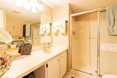 Bath - 130 Cypress Way E #1, Naples, FL 34110 photo 1 of 6