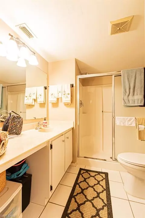 Bath - 130 Cypress Way E #1, Naples, FL 34110 photo 2 of 6