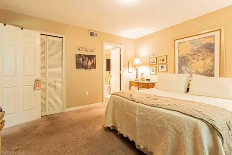 Bedroom - 130 Cypress Way E #1, Naples, FL 34110 photo 4 of 11
