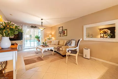 Living - 130 Cypress Way E #1, Naples, FL 34110 photo 1 of 8