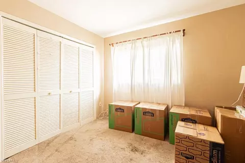 Bedroom - 130 Cypress Way E #1, Naples, FL 34110 photo 10 of 11