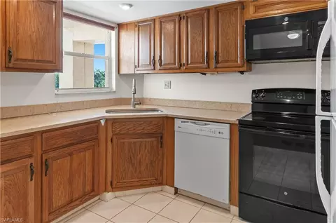 Kitchen - 21 High Point Cir E #305, Naples, FL 34103 photo 2 of 3