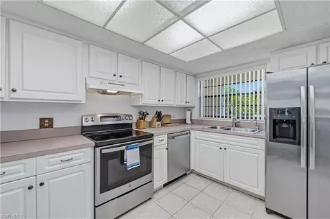 Kitchen - 151 Cypress Way E #C103, Naples, FL 34110 photo 2 of 3