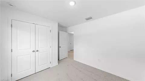 Bedroom - 643 Chambers St E, Lehigh Acres, FL 33974 photo 5 of 7