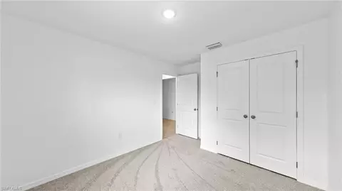 Bedroom - 643 Chambers St E, Lehigh Acres, FL 33974 photo 7 of 7