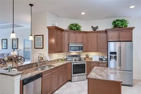 Kitchen - 7587 Moorgate Point Way, Naples, FL 34113 photo 3 of 7