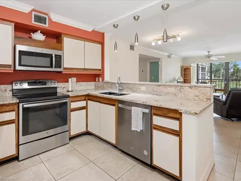 Kitchen - 221 Fox Glen Dr #2201, Naples, FL 34104 photo 2 of 3