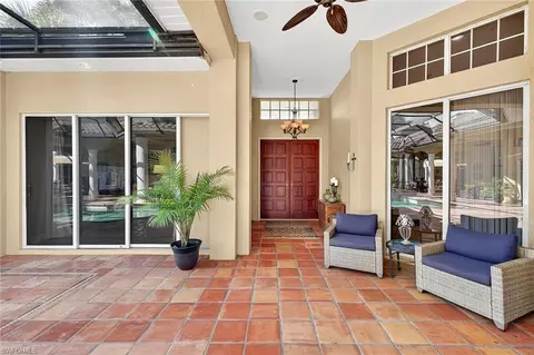Exterior - 556 Eagle Creek Dr, Naples, FL 34113 photo 14 of 19