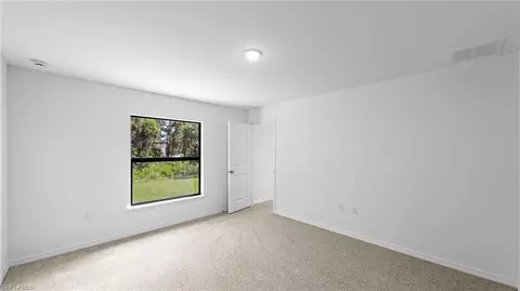 Bedroom - 742 Foxtail St E, Lehigh Acres, FL 33974 photo 2 of 4