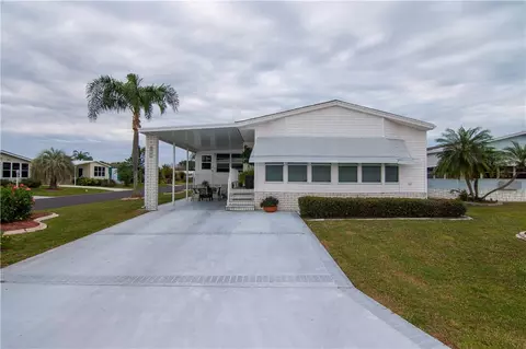 100 Hydrangea Ct, Barefoot Bay, FL 32976 photo 2