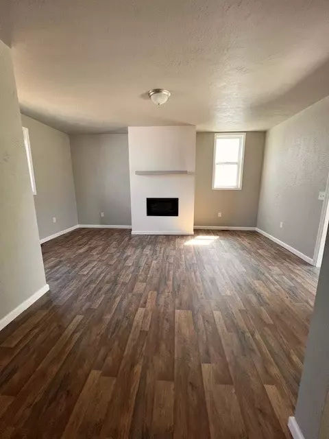 Living - 118 E Smithfield St, Mount Pleasant, PA 15666 photo 2 of 3