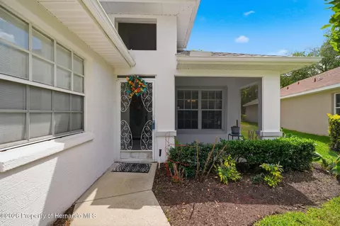 Exterior - 14458 Tamarind Loop, Spring Hill, FL 34609 photo 6 of 10