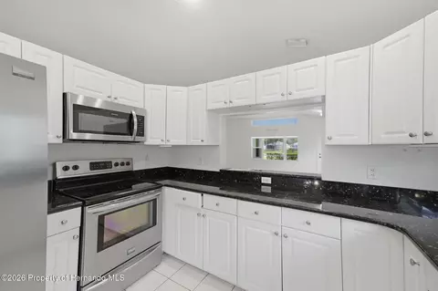 Kitchen - 14458 Tamarind Loop, Spring Hill, FL 34609 photo 4 of 6