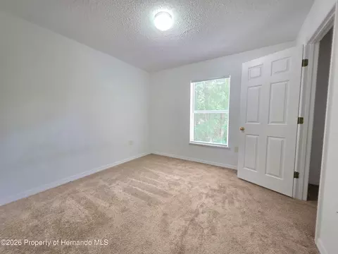 Bedroom - 9055 Pemberton St, Spring Hill, FL 34608 photo 5 of 9