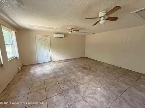 Living - 6134 Pinehurst Dr, Spring Hill, FL 34606 photo 6 of 7