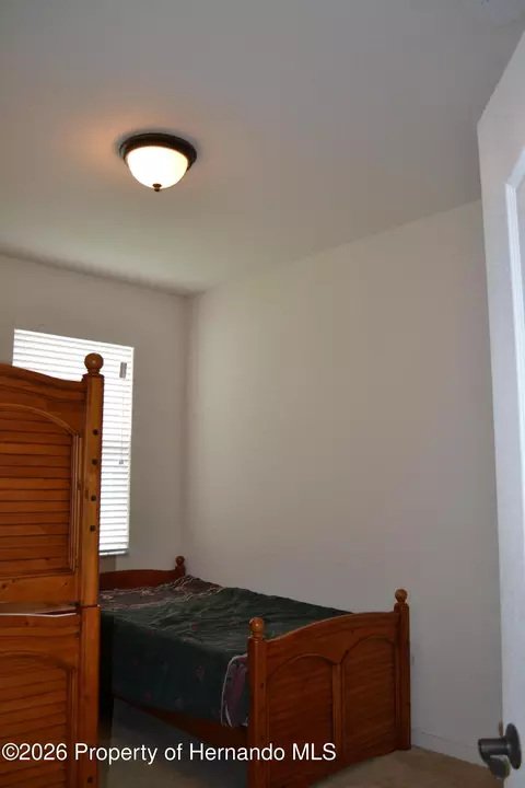 Bedroom - 659 Winthrop Dr, Spring Hill, FL 34609 photo 8 of 11