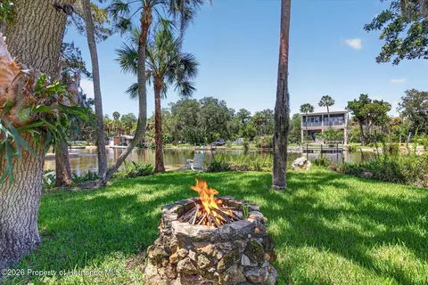 Exterior - 6086 Island Dr, Weeki Wachee, FL 34607 photo 1 of 16