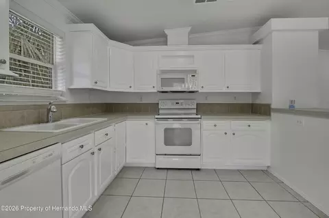 Kitchen - 5610 Ramada St, Weeki Wachee, FL 34607 photo 2 of 4