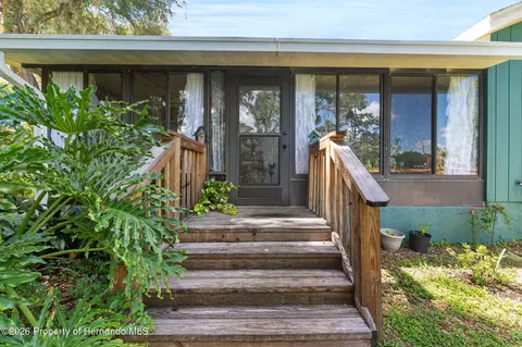 Exterior - 406 E Circlewood St, Inverness, FL 34452 photo 1 of 11
