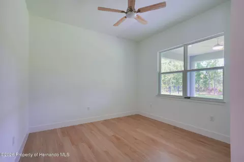 Bedroom - 17460 Macassar Rd, Weeki Wachee, FL 34614 photo 5 of 8