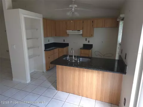 Kitchen - 8190 Sealawn Dr, Spring Hill, FL 34606 photo 2 of 2