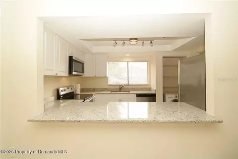 Kitchen - 7851 Pinehurst Dr, Spring Hill, FL 34606 photo 2 of 2