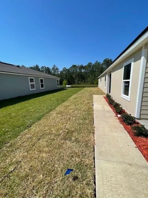 Exterior - 47 Bogey Pl, Bunnell, FL 32110 photo 3 of 19
