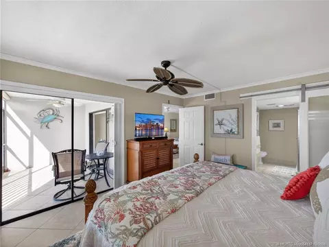 Bedroom - 4680 NE Sandpebble Trce #103, Stuart, FL 34996 photo 3 of 5