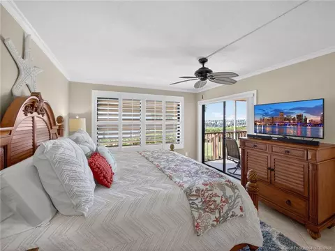 Bedroom - 4680 NE Sandpebble Trce #103, Stuart, FL 34996 photo 2 of 5