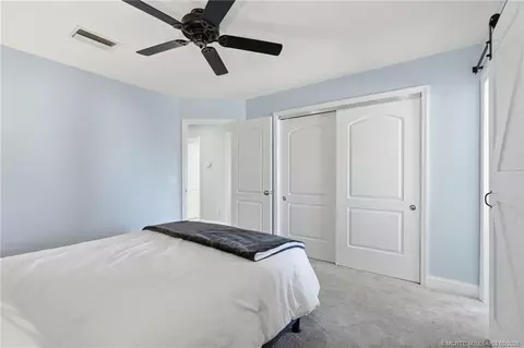 Bedroom - 5657 SE Foxcross Pl, Stuart, FL 34997 photo 4 of 10