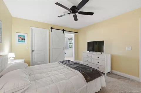 Bedroom - 5657 SE Foxcross Pl, Stuart, FL 34997 photo 7 of 10