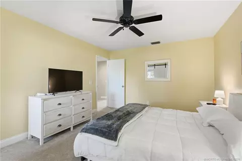 Bedroom - 5657 SE Foxcross Pl, Stuart, FL 34997 photo 9 of 10
