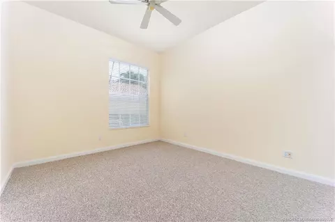 Bedroom - 1477 SW Eagleglen Pl, Stuart, FL 34997 photo 5 of 5