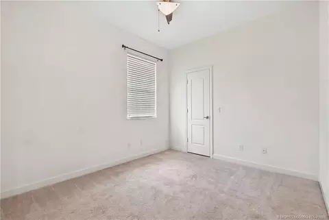Bedroom - 9456 SW Merlin Ct, Stuart, FL 34997 photo 3 of 5