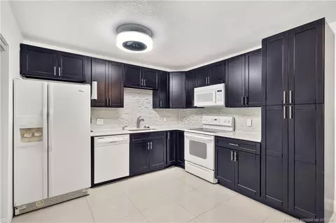 Kitchen - 5708 SE Windsong Ln, Stuart, FL 34997 photo 2 of 3