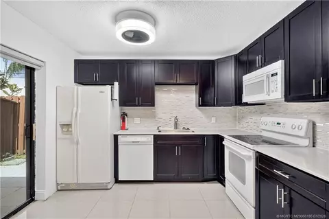 Kitchen - 5708 SE Windsong Ln, Stuart, FL 34997 photo 3 of 3