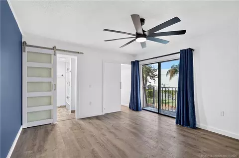 Bedroom - 5708 SE Windsong Ln, Stuart, FL 34997 photo 2 of 4