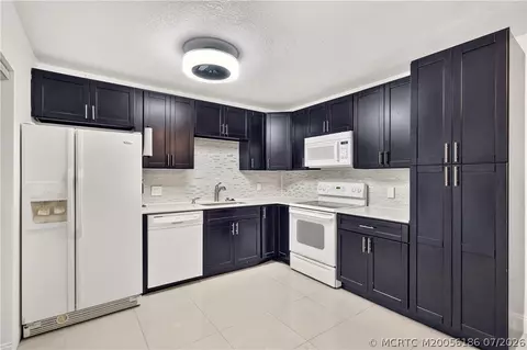 Kitchen - 5708 SE Windsong Ln, Stuart, FL 34997 photo 1 of 2