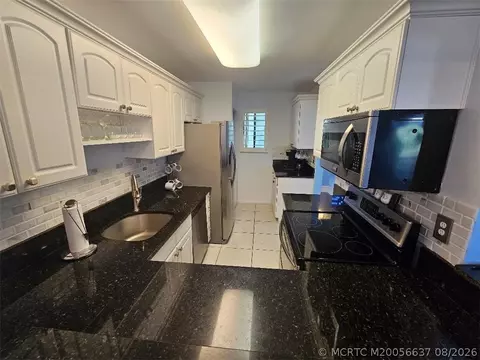 Kitchen - 5433 SE Miles Grant Rd #E-205, Stuart, FL 34997 photo 1 of 2