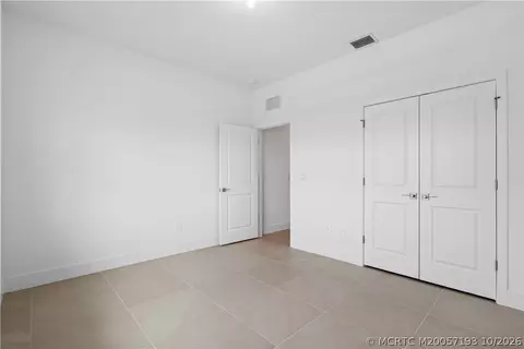 Bedroom - 7030 SE Park Trace Dr, Stuart, FL 34997 photo 3 of 7