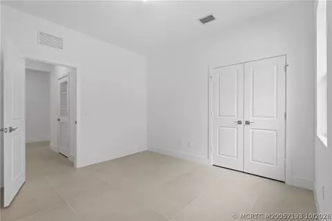 Bedroom - 7030 SE Park Trace Dr, Stuart, FL 34997 photo 5 of 7