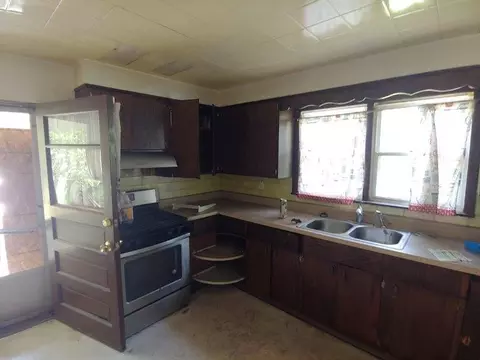 Kitchen - 28 W 30th St, Steger, IL 60475 photo 2 of 3