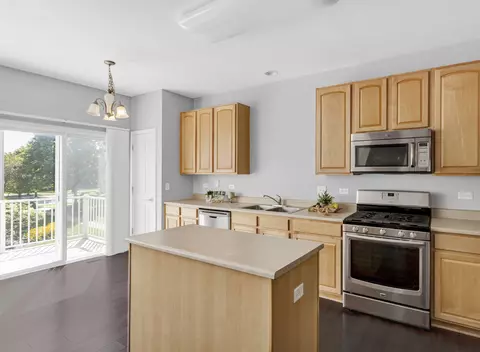 Kitchen - 763 Thornbury Ct #102-3, Bartlett, IL 60103 photo 2 of 2