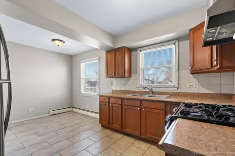 Kitchen - 256 E 148th St, Harvey, IL 60426 photo 2 of 4