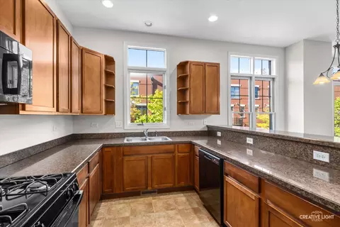 Kitchen - 157 River Walk Ct, Elgin, IL 60120 photo 2 of 2
