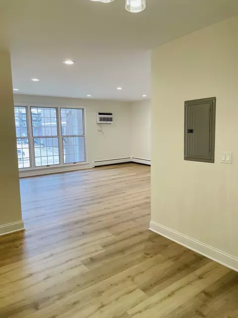 Living - 1777 Dewes St #E, Glenview, IL 60025 photo 1 of 2