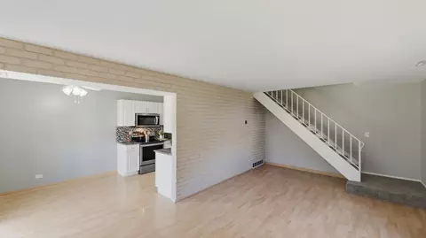 Living - 1694 Valley Forge Ct #D, Wheaton, IL 60189 photo 2 of 3