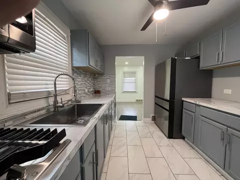 Kitchen - 93 E 151st St, Harvey, IL 60426 photo 2 of 3