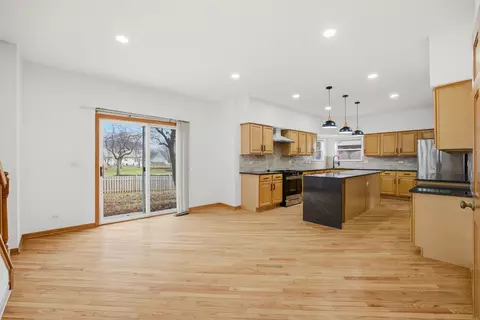 Living - 2812 Stuart Kaplan Ct, Aurora, IL 60503 photo 3 of 11