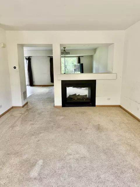 Living - 1110 Symphony Dr, Aurora, IL 60504 photo 2 of 5
